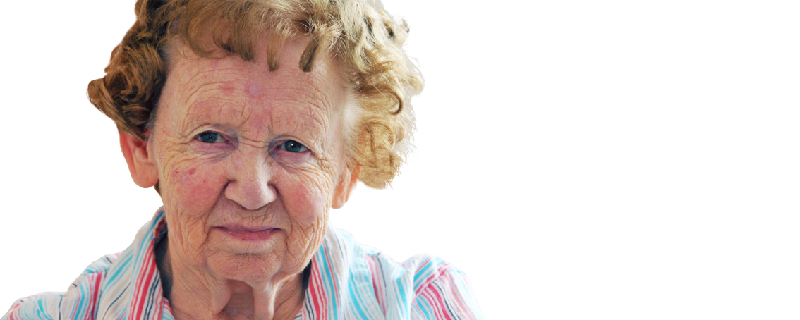 An elderly woman with short, curly hair and wearing a striped shirt looks slightly to the side against a plain white background.