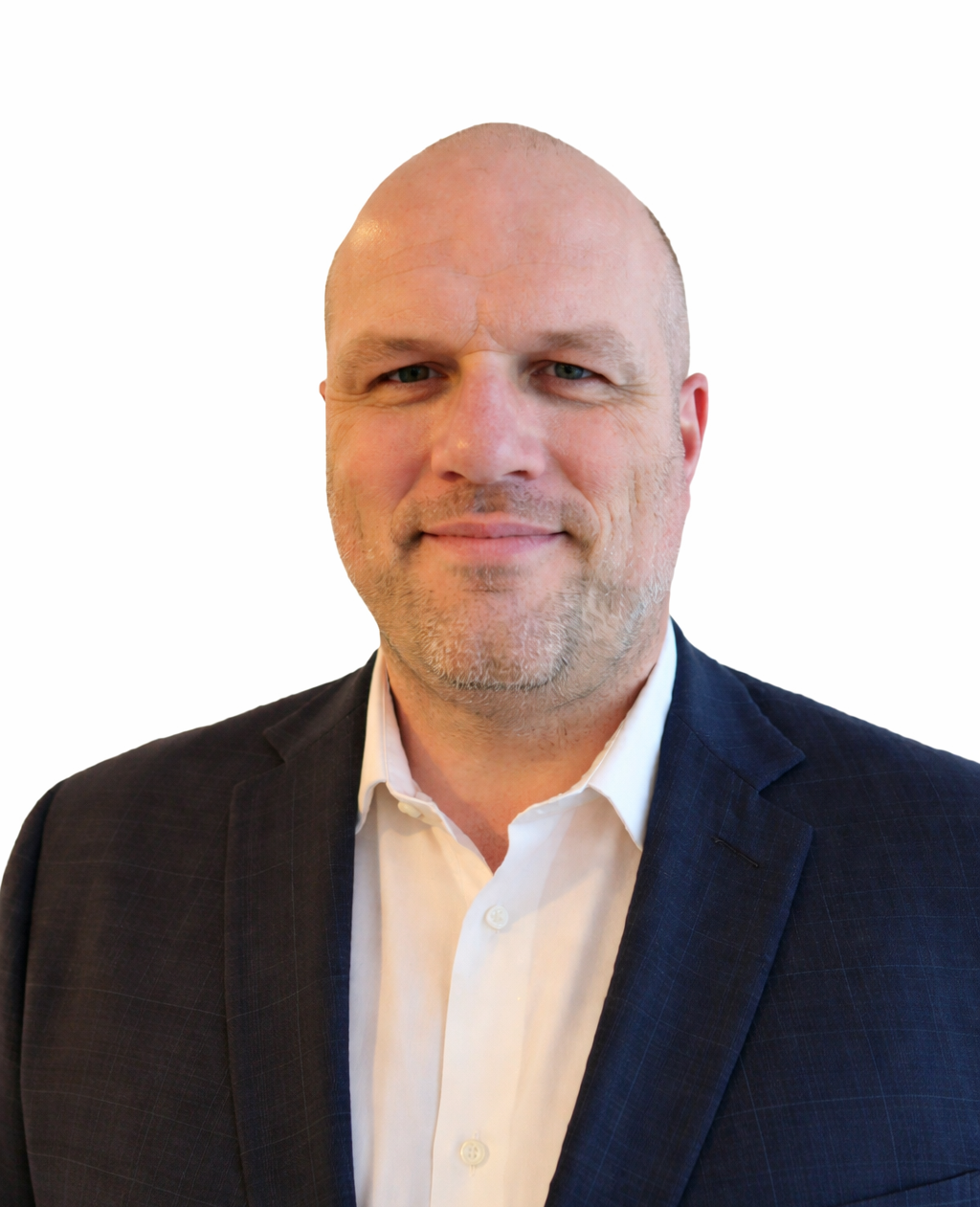 A middle-aged man with a shaved head wearing a dark suit jacket and white shirt, standing against a plain white background.