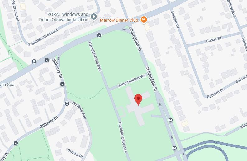 A map showing the intersection of Champlain St and John Holden Way in a residential area near Famille-Côté Ave, with nearby businesses like Extendicare Beauclaire clearly labeled.